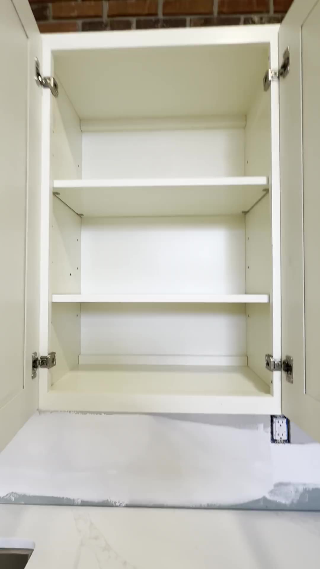 Soft-close hinges on an installed cabinet door